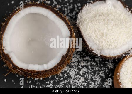 white coconut pulp and dried coconut flakes, a close-up of which is used in the preparation of desserts Stock Photo