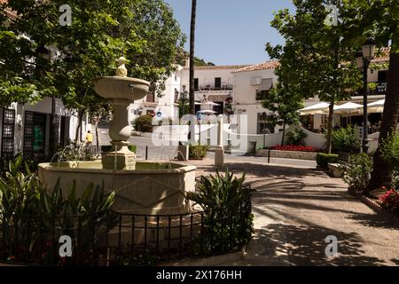 Fountain on the cozy square surrounded by shops and restaurants in the mountain village of Mijas, Andalusia; Costa del Sol, Spain. Stock Photo