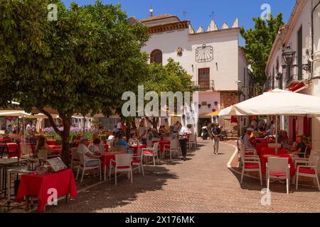 Cozy little square with shops and restaurants on the Plaza de los Naranjos square in the old center of Marbella. Stock Photo