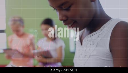 Image of data processing and numbers over diverse school children using tablets Stock Photo