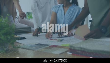 Image of white spots over diverse business people talking in office Stock Photo