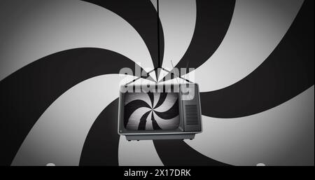 Image of black and white stripes spinning over retro tv on black and white stripes background Stock Photo