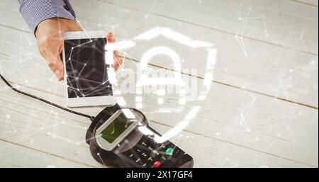 Image of network of connections and security padlock over smartphone and payment terminal Stock Photo