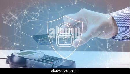 Image of network of connections and security padlock on shield over payment terminal Stock Photo