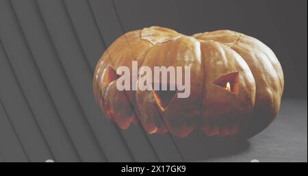 Image of lines over jack o lantern halloween pumpkin on grey background Stock Photo