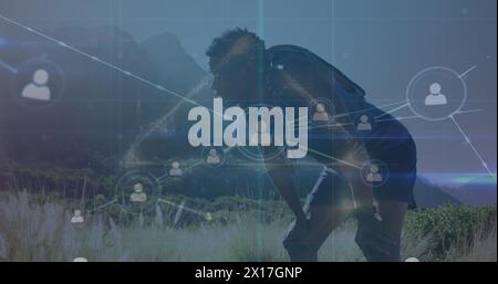 Image of network of connections over african american male hiker Stock Photo