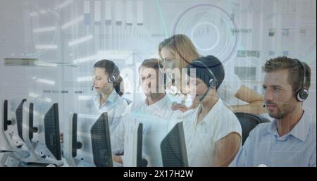 Image of infographic interface, caucasian female manager discussing with coworker over desktop Stock Photo