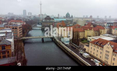 Awe Drone view on Ebertsbrucke and Monbijou bridge over Spree river and  Bode-Museum in foggy Berlin. Berliner Fernsehturm and Berlin Cathedral in dis Stock Photo