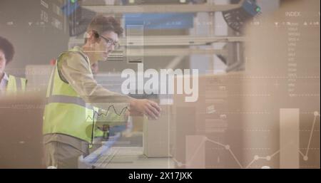 Image of statistic charts over diverse workers in warehouse Stock Photo