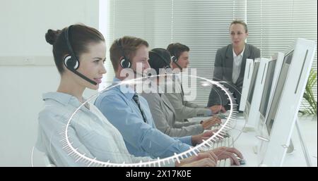 Image of network of connections over caucasian office workers wearing headsets Stock Photo