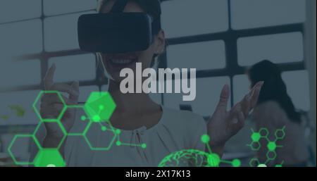 Image of human brains spinning and data processing over businesswoman wearing vr headset Stock Photo