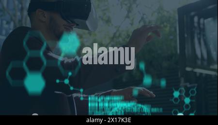 Image of human brains spinning and data processing over man wearing vr headset Stock Photo