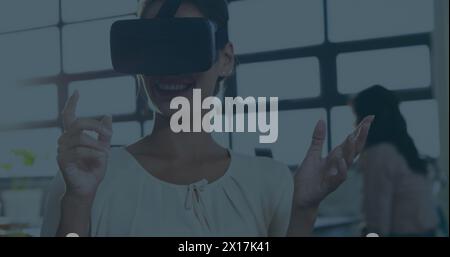 Image of human brain spinning and data processing over businesswoman wearing vr headset Stock Photo