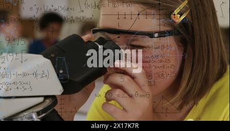 Image of mathematical formulae over schoolgirl using microscope Stock Photo