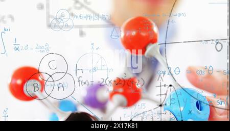 Image of mathematical formulae over scientist Stock Photo