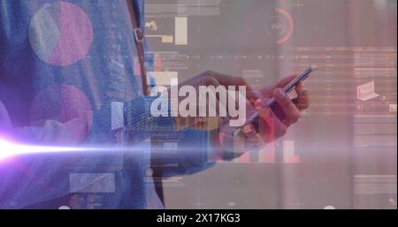 Image of graphs over hands of caucasian man using smartphone Stock Photo