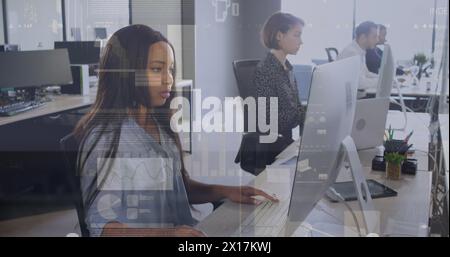 The colleagues are typing on their computers Stock Photo