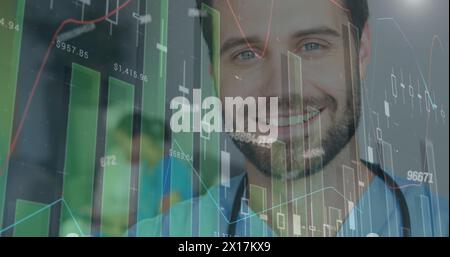 Image of statistical data processing and numbers over caucasian male doctor smiling at hospital Stock Photo