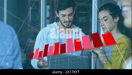Image of financial data processing over diverse businesspeople in office Stock Photo