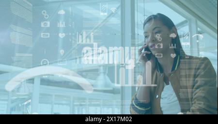 Image of data processing over biracial businesswoman Stock Photo