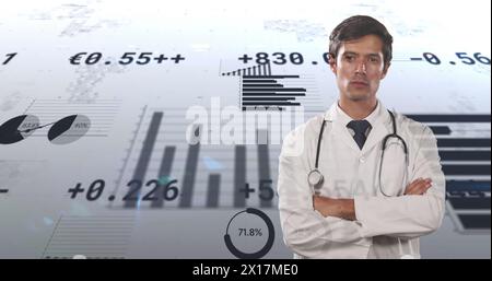 Image of financial data and graphs over caucasian male doctor Stock Photo