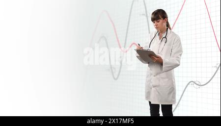 Image of financial data and graphs over caucasian female doctor Stock Photo