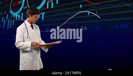Image of financial data and graphs over caucasian male doctor Stock Photo