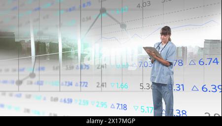 Image of financial data and graphs over caucasian female doctor Stock Photo