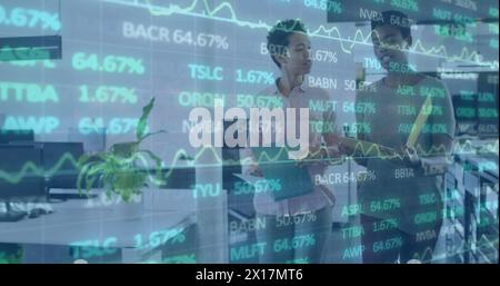 The businesswomen are talking and walking in the office Stock Photo