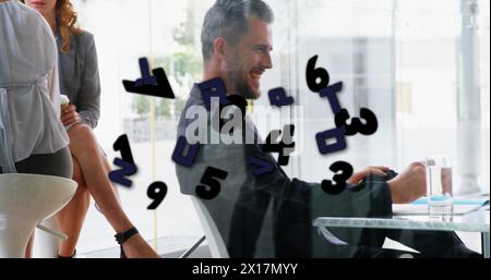 Image of numbers processing over caucasian businessman in office Stock Photo