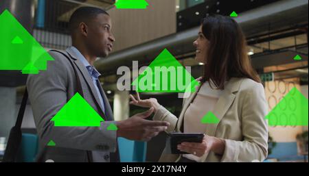 Image of arrows and data processing over diverse business people in office Stock Photo