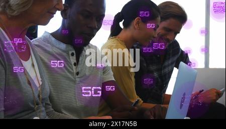 Image of multiple 5g texts over diverse coworkers sharing ideas in office Stock Photo