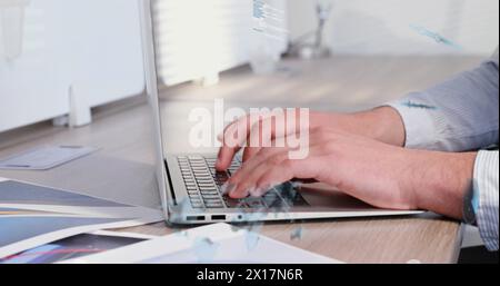 Image of radars, maps, soundwaves and computer language over caucasian man working on laptop Stock Photo