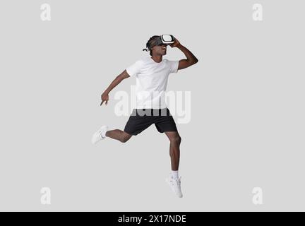 Young man in VR headset with dynamic pose Stock Photo