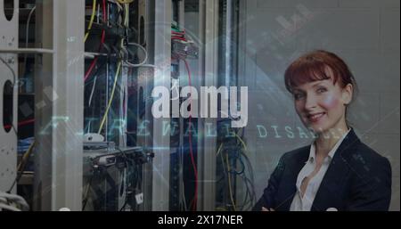 Cyber security data processing against portrait of caucasian female engineer smiling in server room Stock Photo