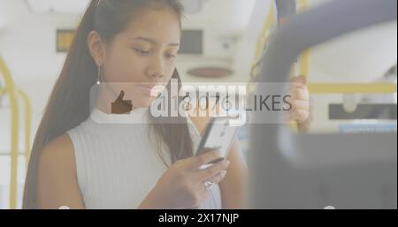 Image of like icons with increasing numbers against asian woman using smartphone in the bus Stock Photo