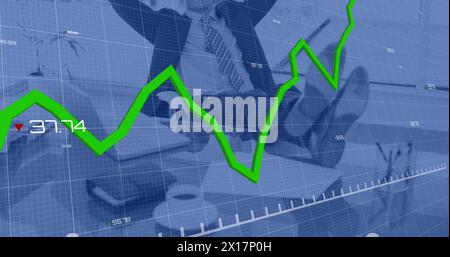 Image of statistical data processing against mid section of businessman relaxing on his desk Stock Photo