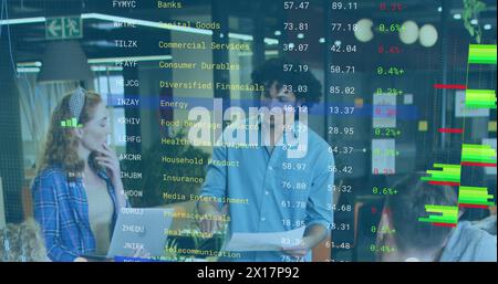 Image of financial report over diverse businessman sharing ideas with colleagues in meeting Stock Photo