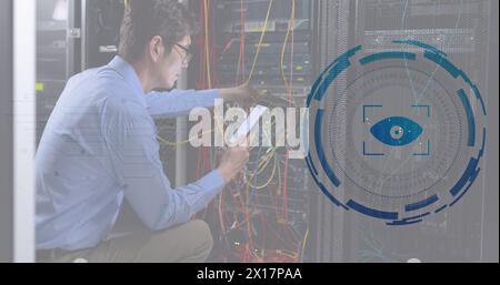 Image retina round scanner against asian male engineer using digital tablet at server room Stock Photo