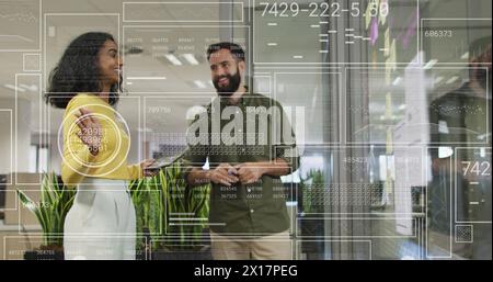 Image of financial data processing over diverse businesspeople in office Stock Photo