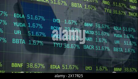 Image of stock market data processing against close up of a smartphone Stock Photo