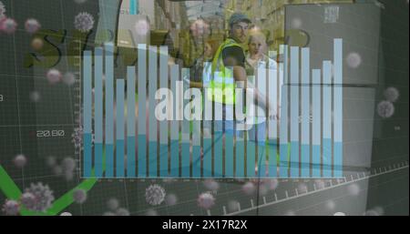 Image of financial data processing and virus cells over diverse workers in warehouse Stock Photo