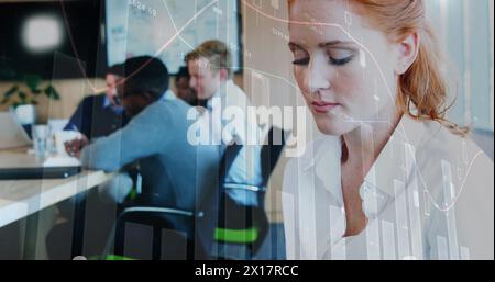 A female executive is using a digital tablet at her office Stock Photo