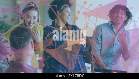 Image of plexus networks over diverse colleagues smiling together at office Stock Photo