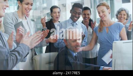 Image of statistical data processing against diverse businesspeople clapping together at office Stock Photo