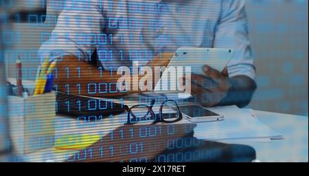 Image of data processing over african american businessman using tablet Stock Photo