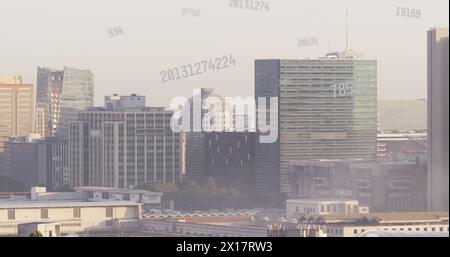 Image of numbers and data processing over cityscape Stock Photo