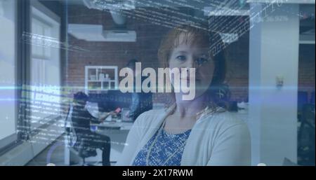 Image of binary codes, computer language, trading board over caucasian woman standing in office Stock Photo