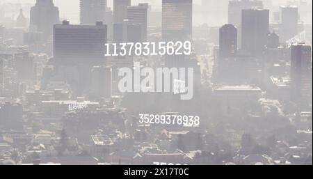 Image of numbers and data processing over cityscape Stock Photo