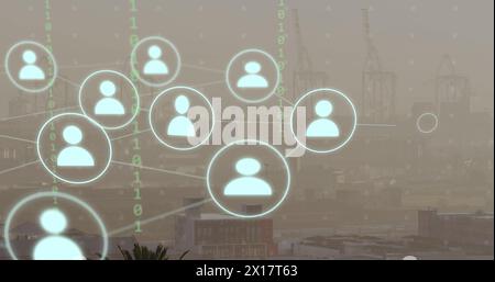 Image of network of connections with icons and binary coding over cityscape Stock Photo